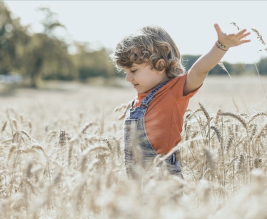 Child playing in a field