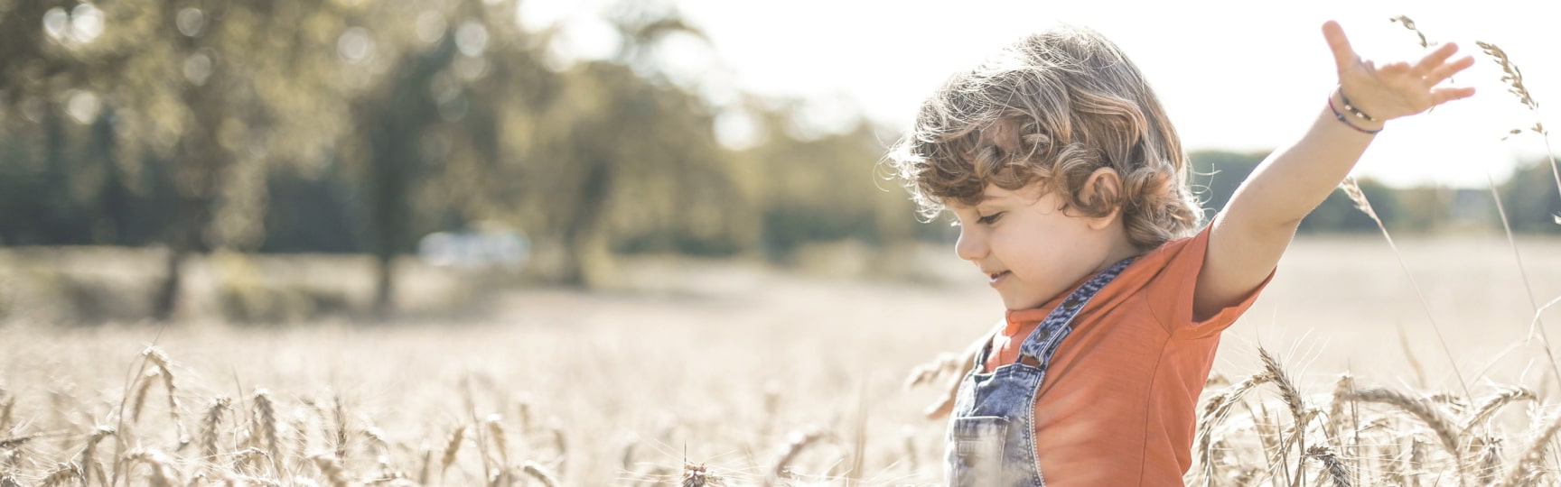 Child playing in a field